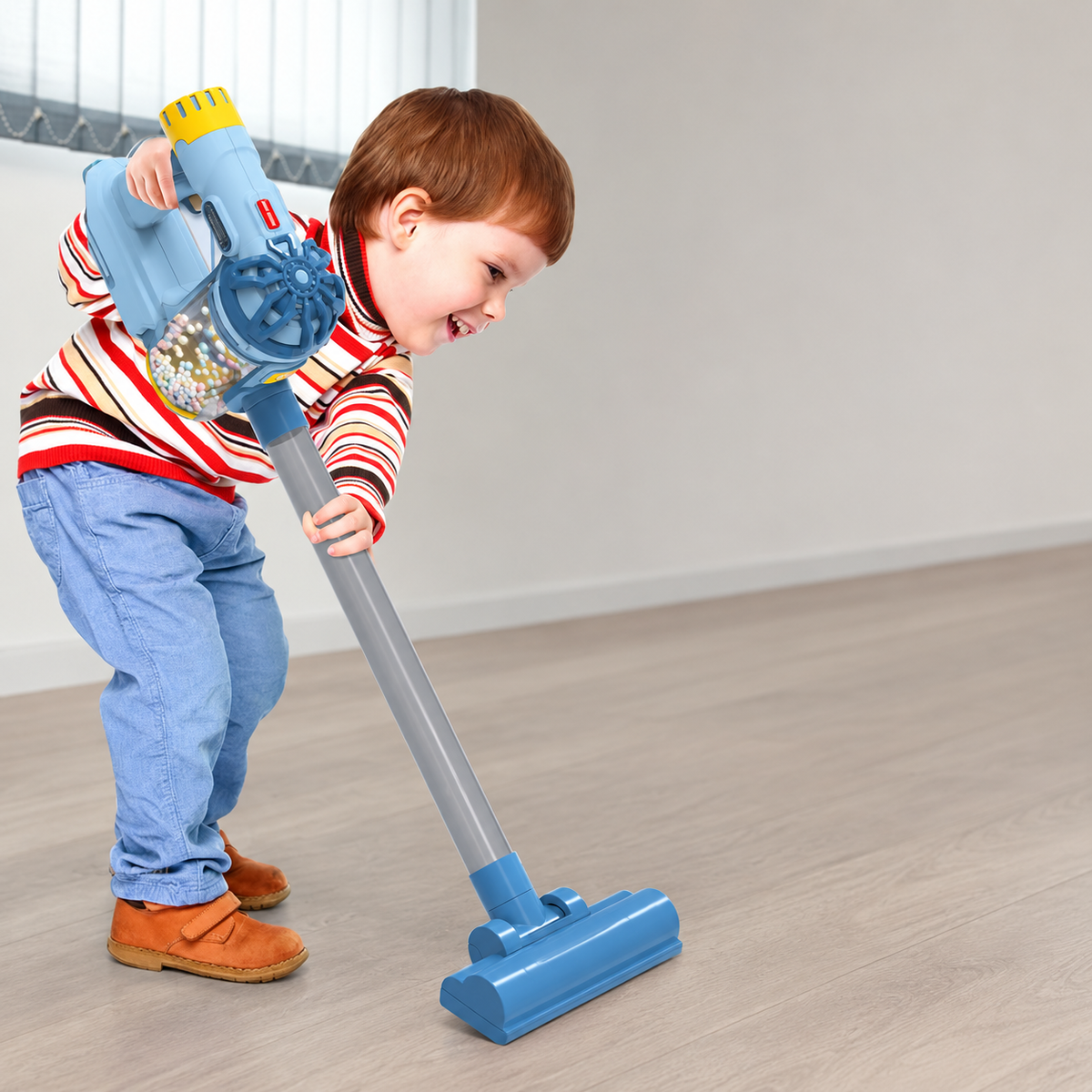 Child using the blue toy vacuum cleaner in a home play setting