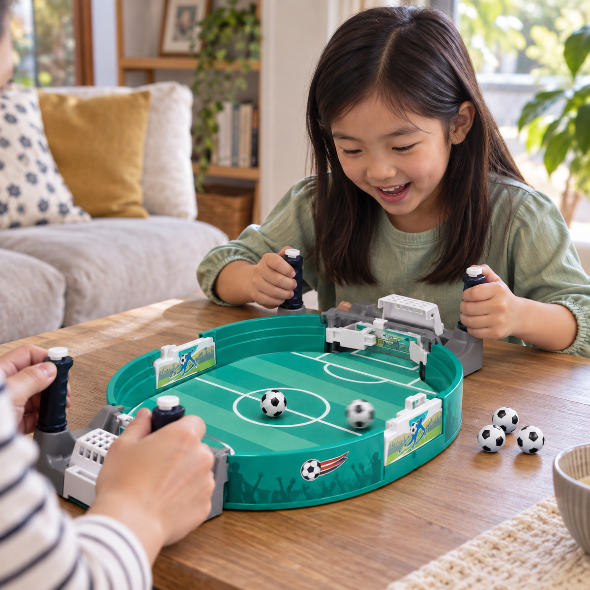 A child using the Table Football Pinball Game with 6 Balls during play