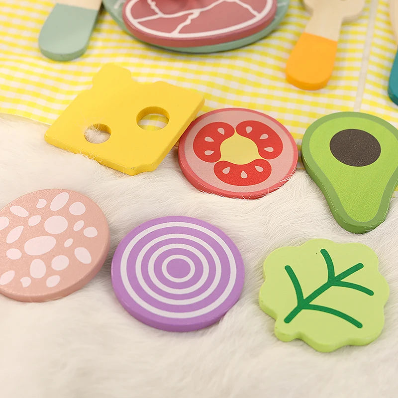 Wooden play food including cheese, tomato, avocado and onion