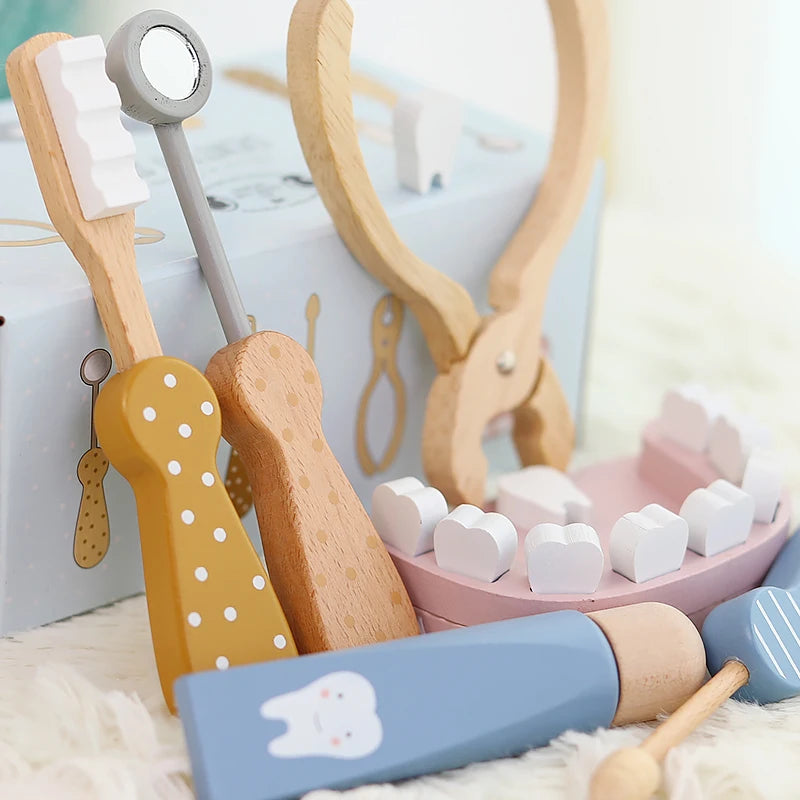 Close-up of wooden dentist tools and removable toy teeth