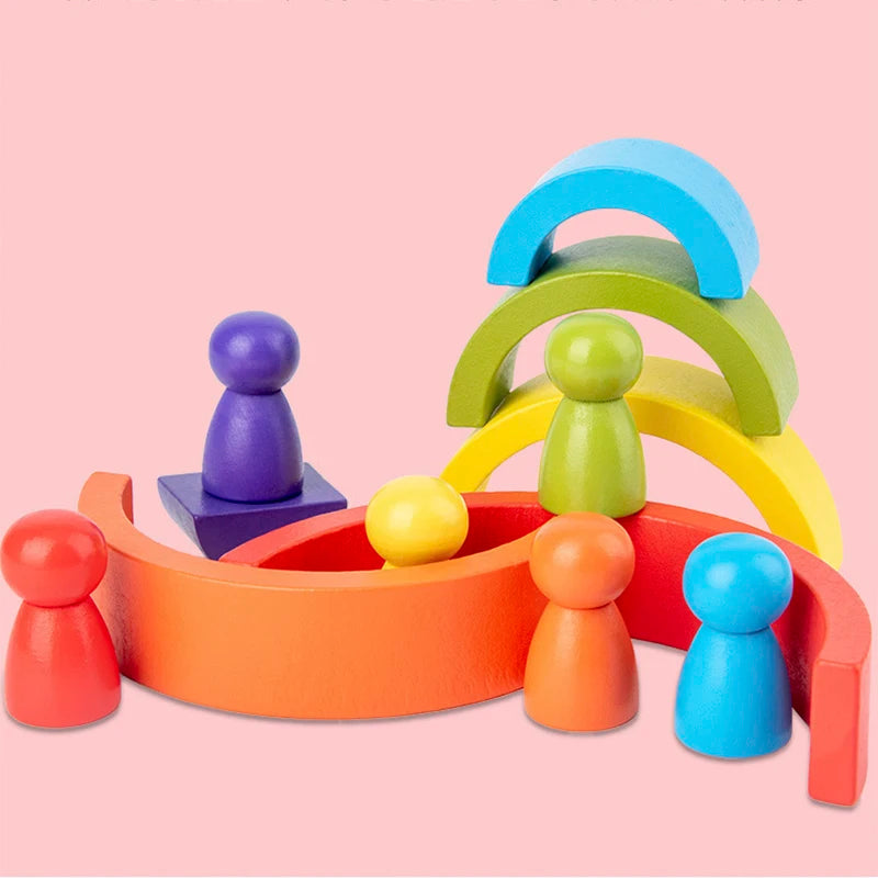 Wooden rainbow arches arranged as imaginative play structures